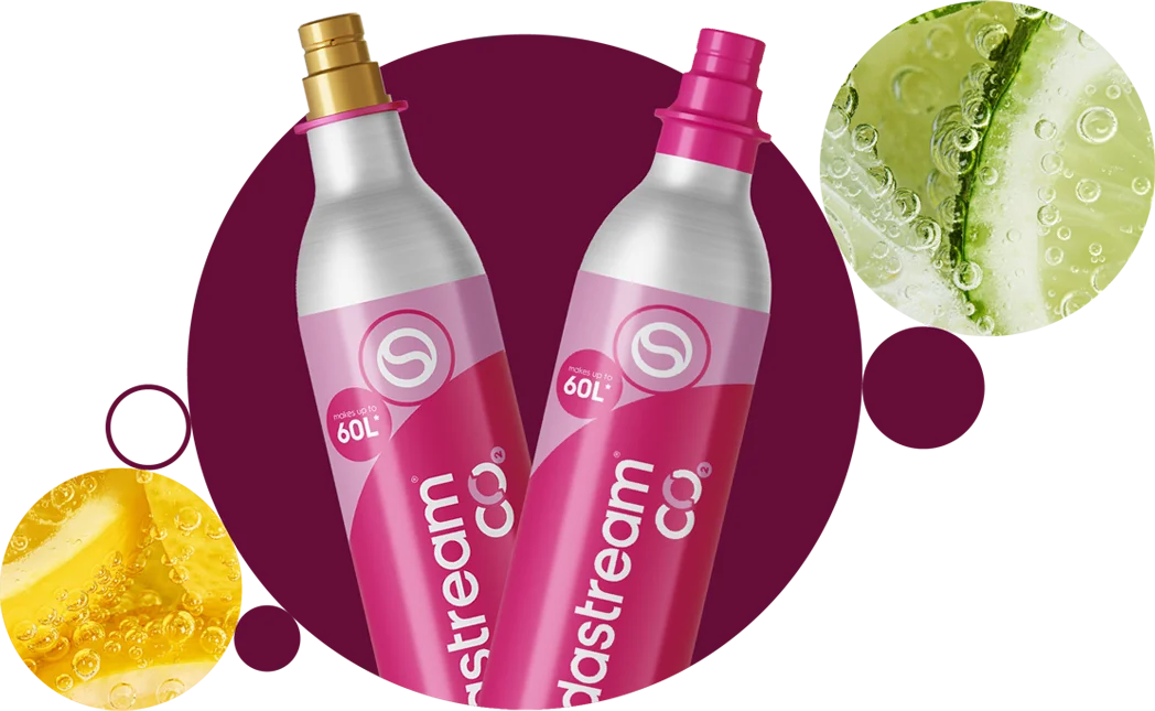 Dwa różowe naboje z gazem CO2 na tle kolorowych bąbelków